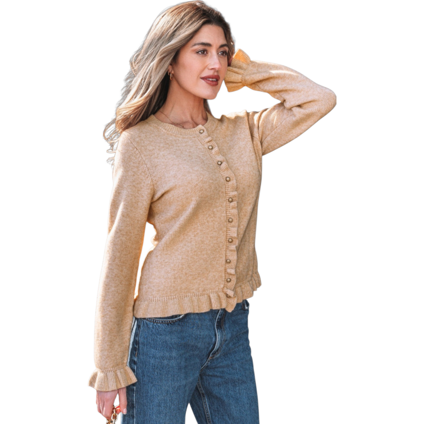 A woman wearing a camel-coloured, long-sleeve knit cardigan featuring feminine ruffle trim along the hem, cuffs, and button placket with small gold buttons. 