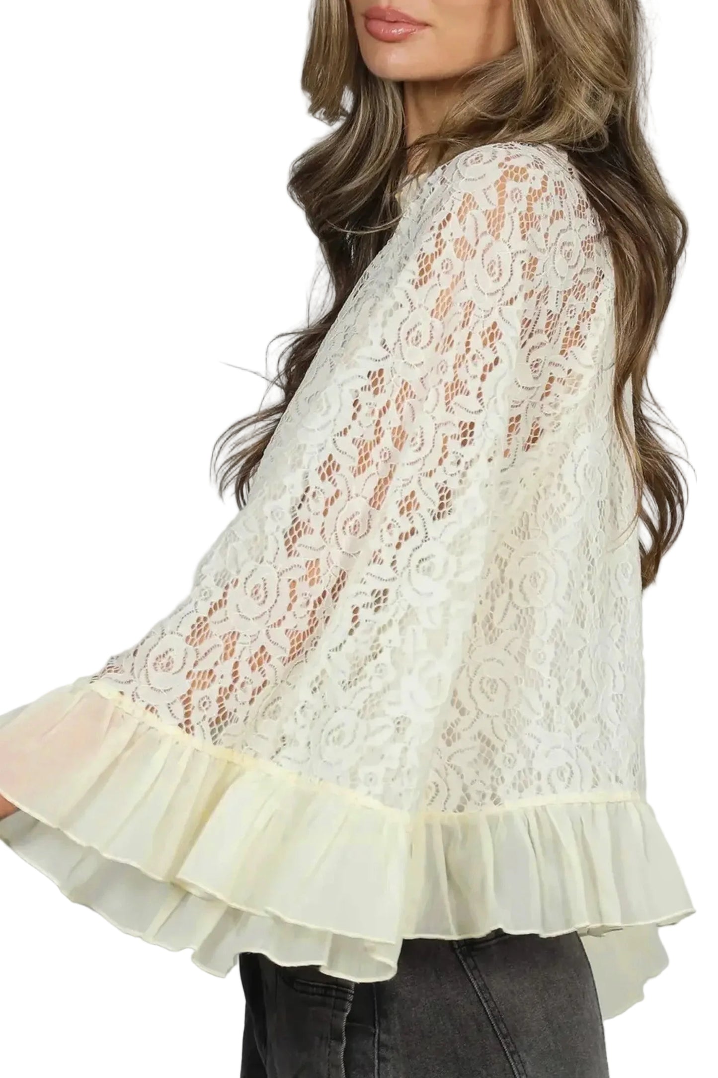 Lace blouse with ruffled hem on a plain background