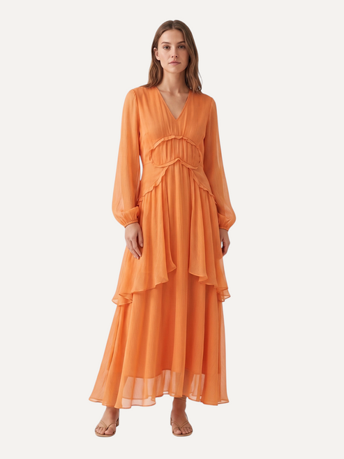 Catherine Martin orange mulberry silk maxi dress with V-neck, long sleeves, and tiered ruffle skirt on a model.