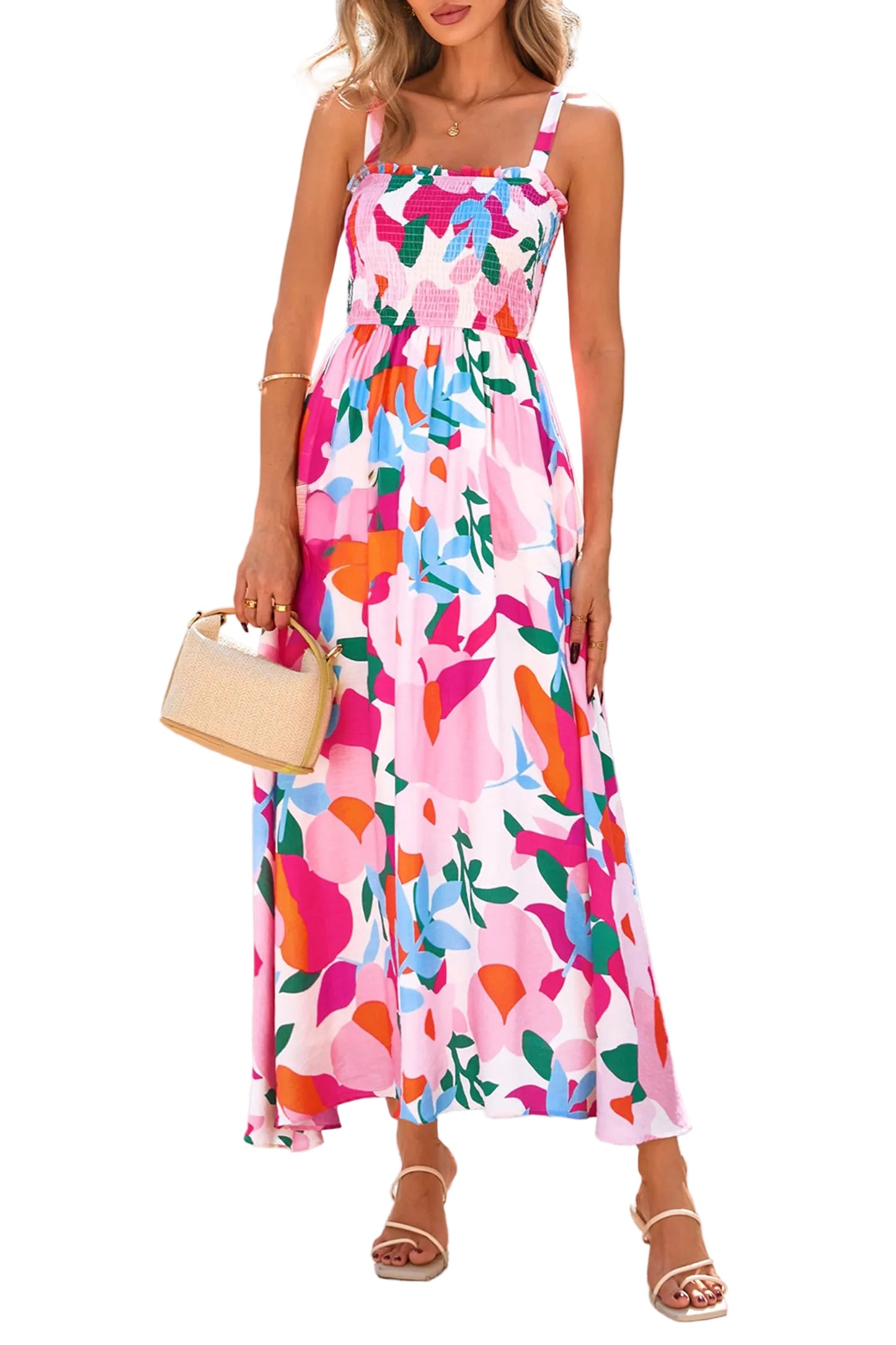 Woman wearing a colorful floral dress holding a beige handbag.