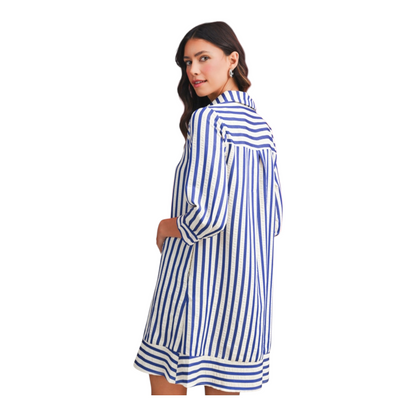 Woman wearing a blue and white striped dress on a white background