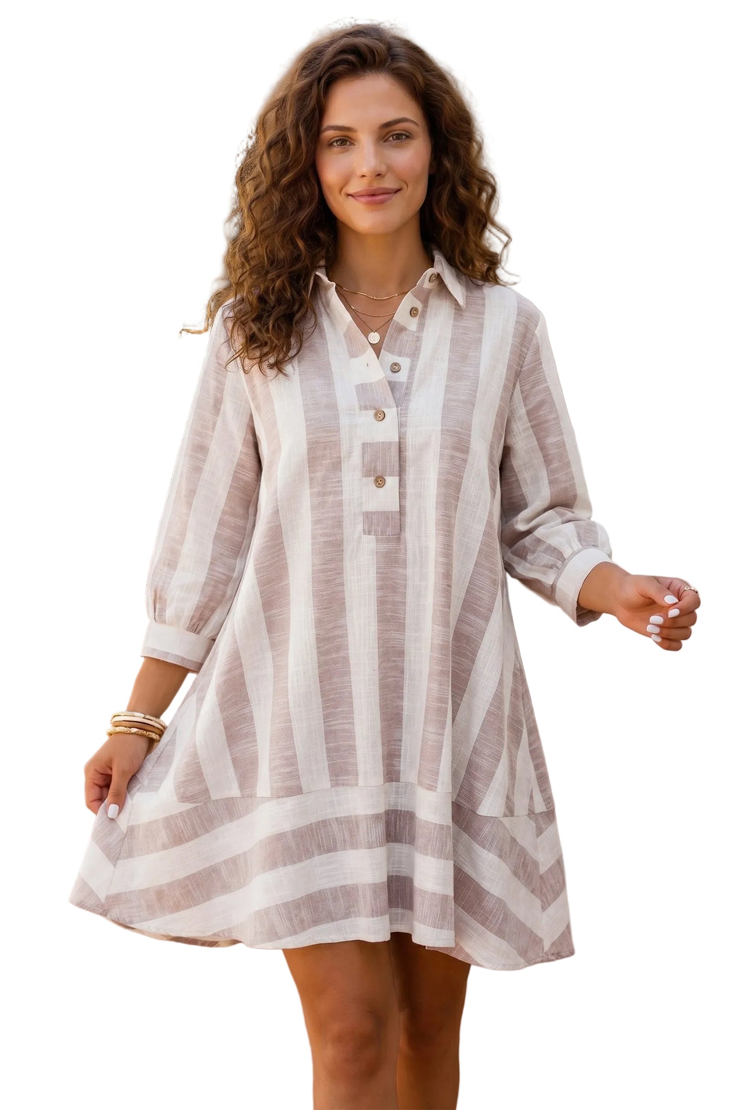 A woman wearing a long-sleeve linen shirt dress with vertical stripes in beige and off-white, standing against a white background