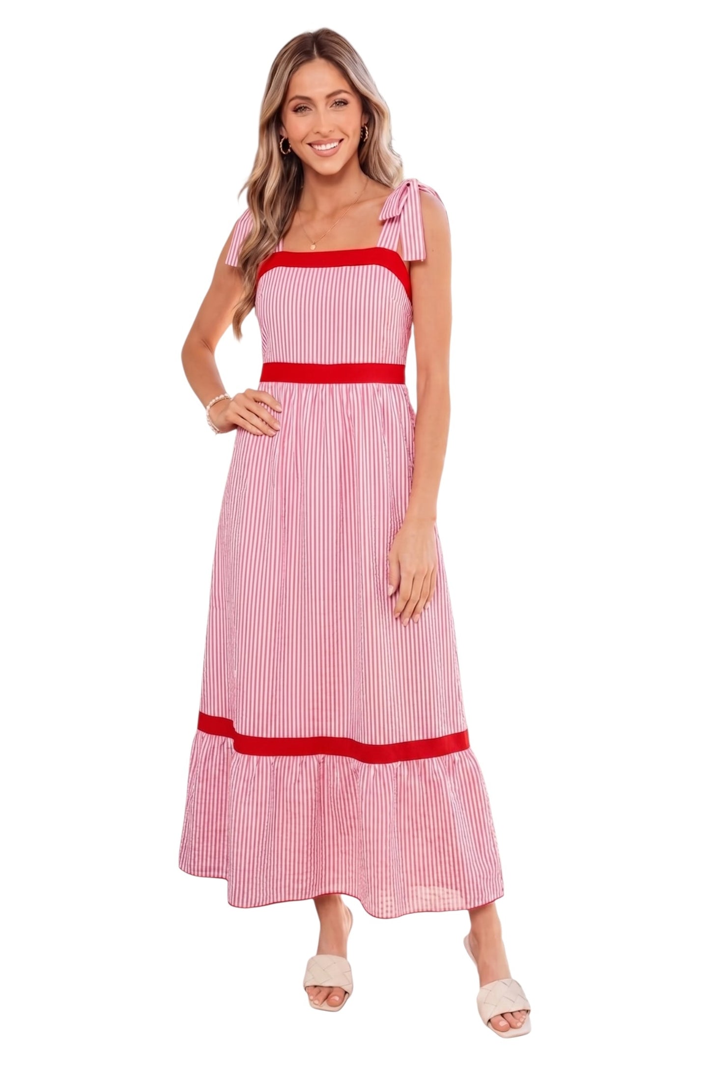 Woman wearing a red and white striped dress on a white background