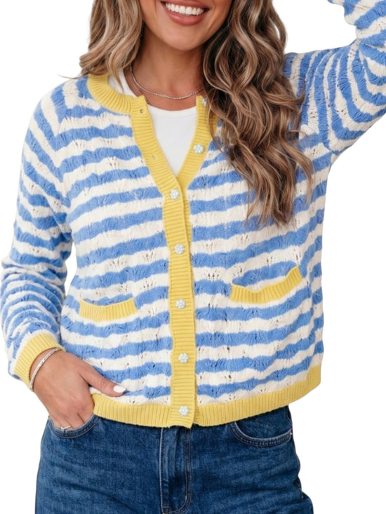 A woman wearing a blue and white striped knit cardigan with yellow trim over a white top and blue jeans, shown against a plain white background.