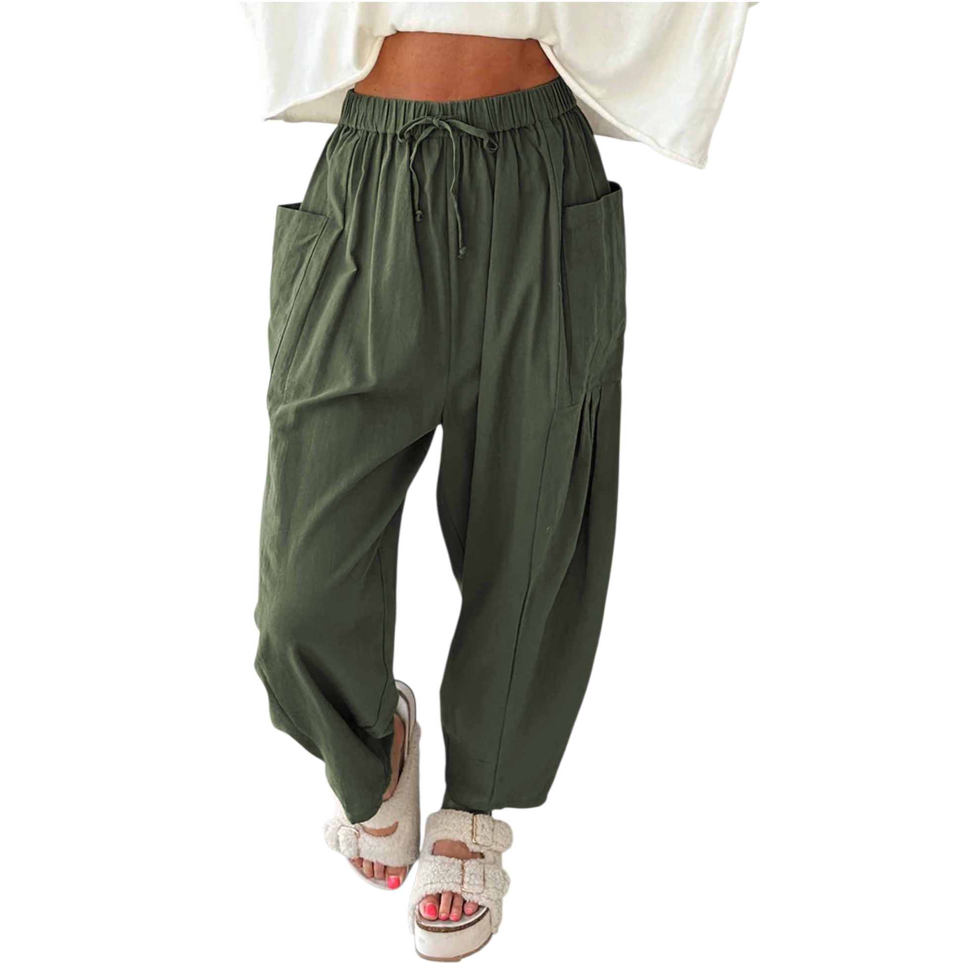 Green baggy pants worn by a person on a white background