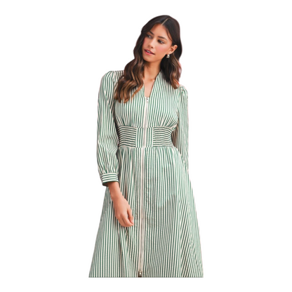 Woman wearing a green and white striped dress on a white background