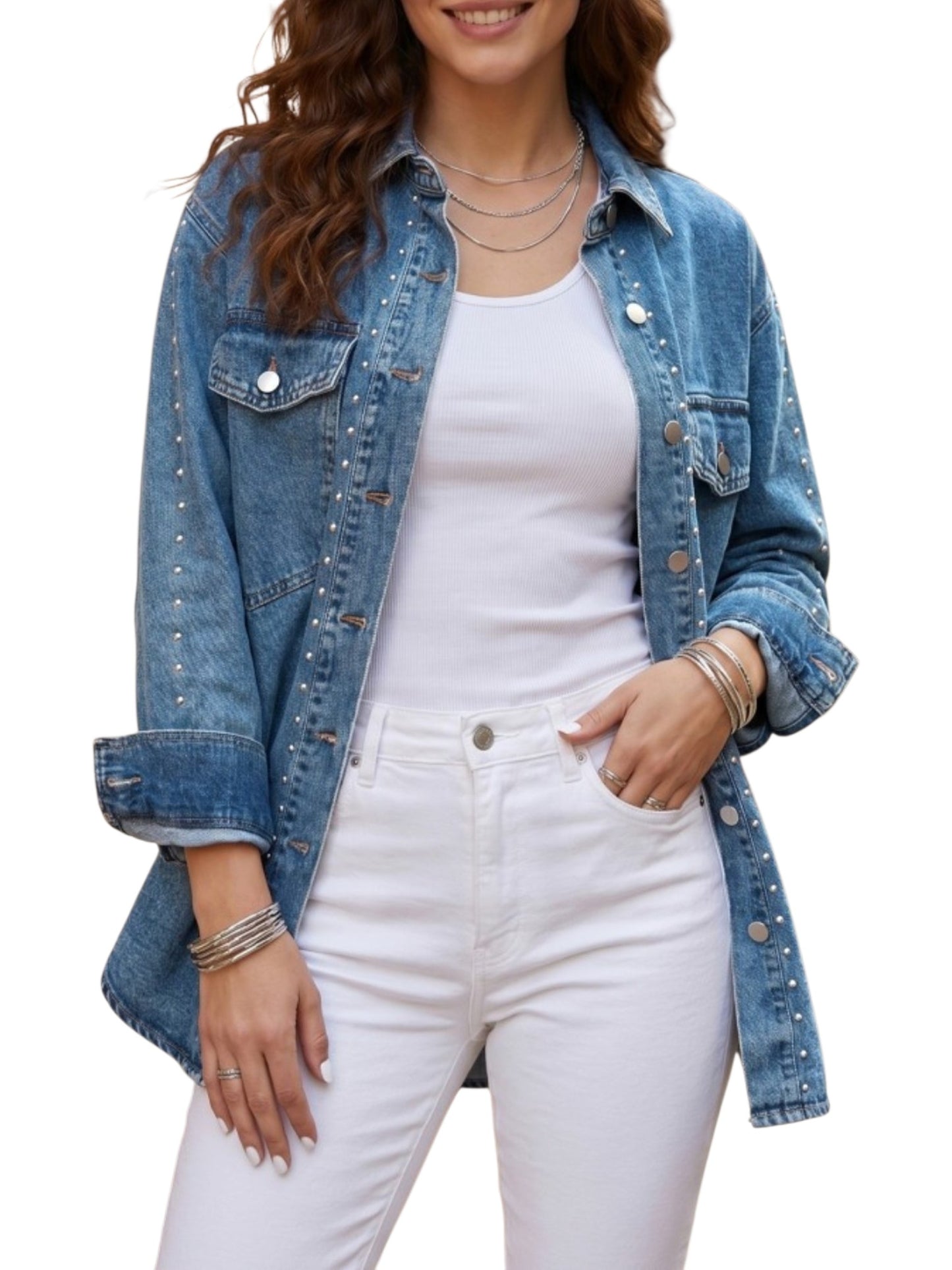 A woman wearing a light blue denim jacket with silver stud embellishments, layered over a white tank top and white jeans, shown against a plain white background.