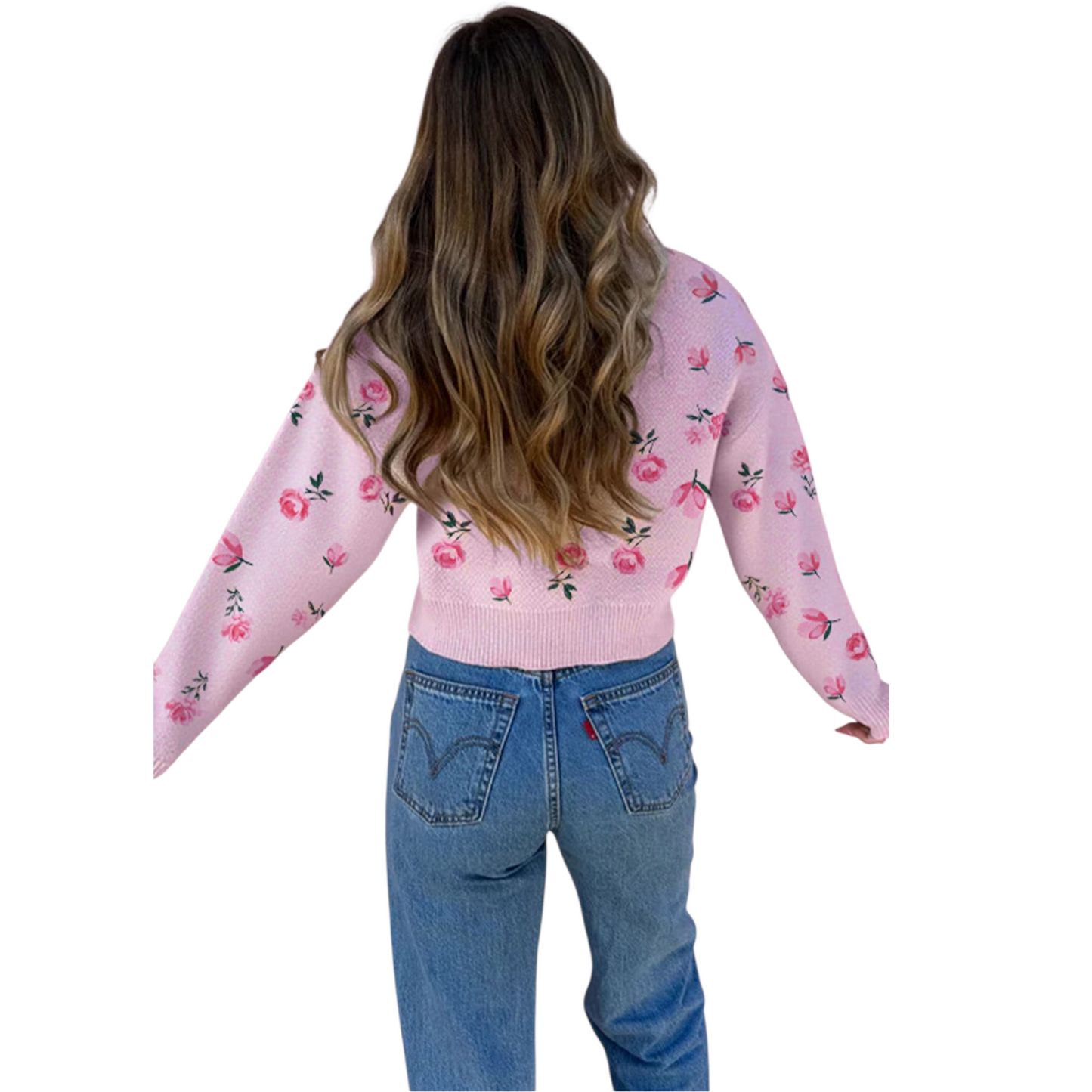 Person wearing a pink floral sweater and blue jeans on a white background