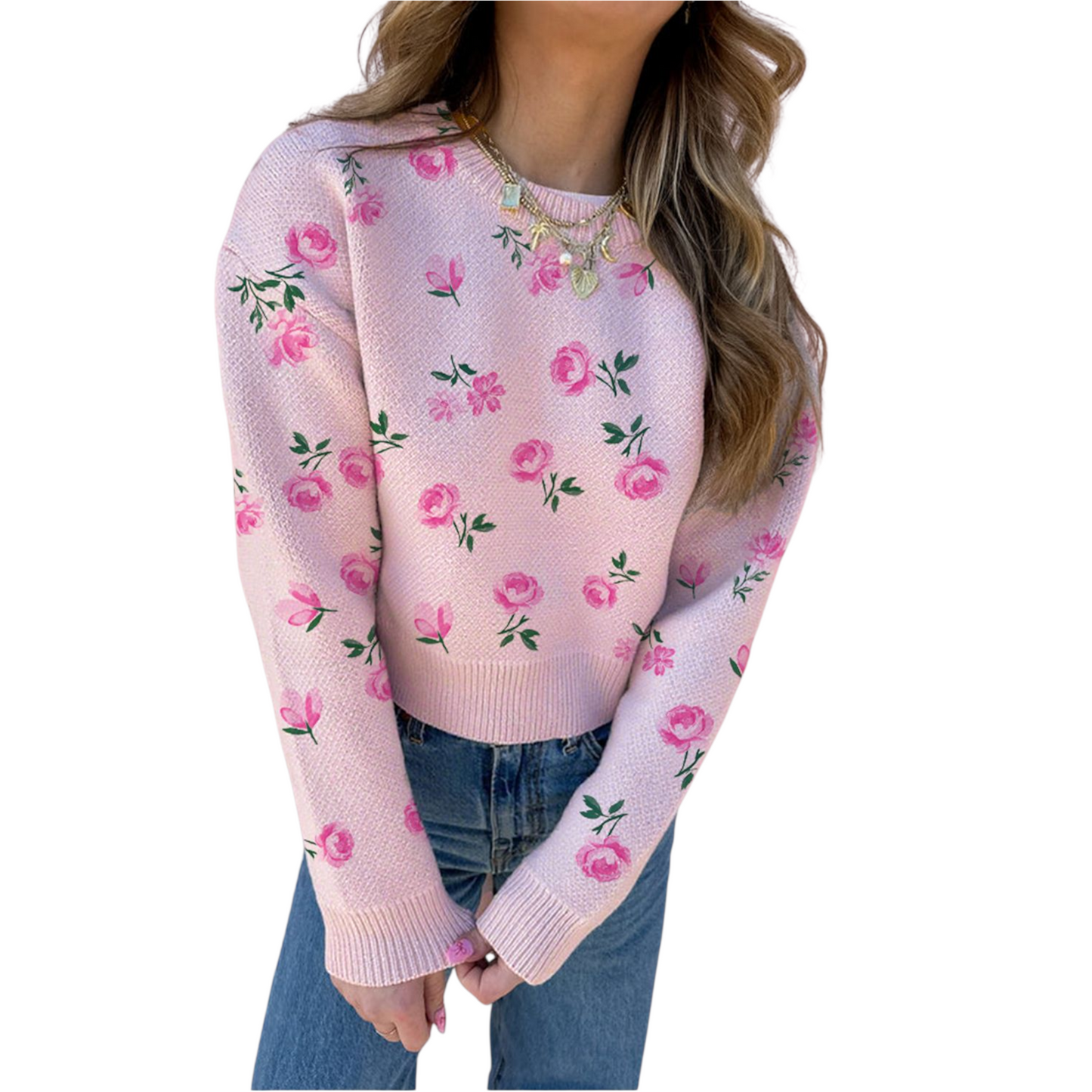 Pink floral sweater worn by a person on a white background