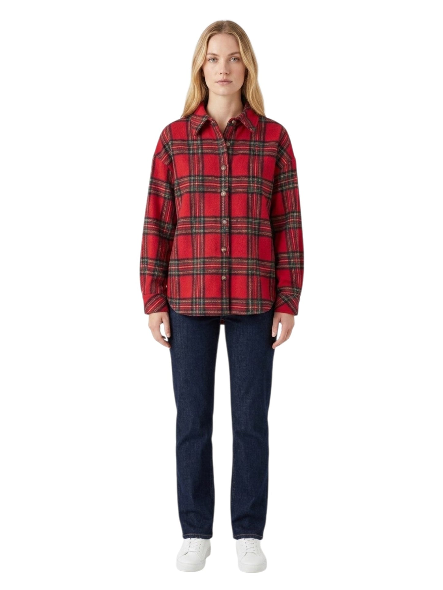 A woman modeling a red and black plaid button-up shirt jacket with dark blue jeans and white sneakers, shot against a plain white background.
