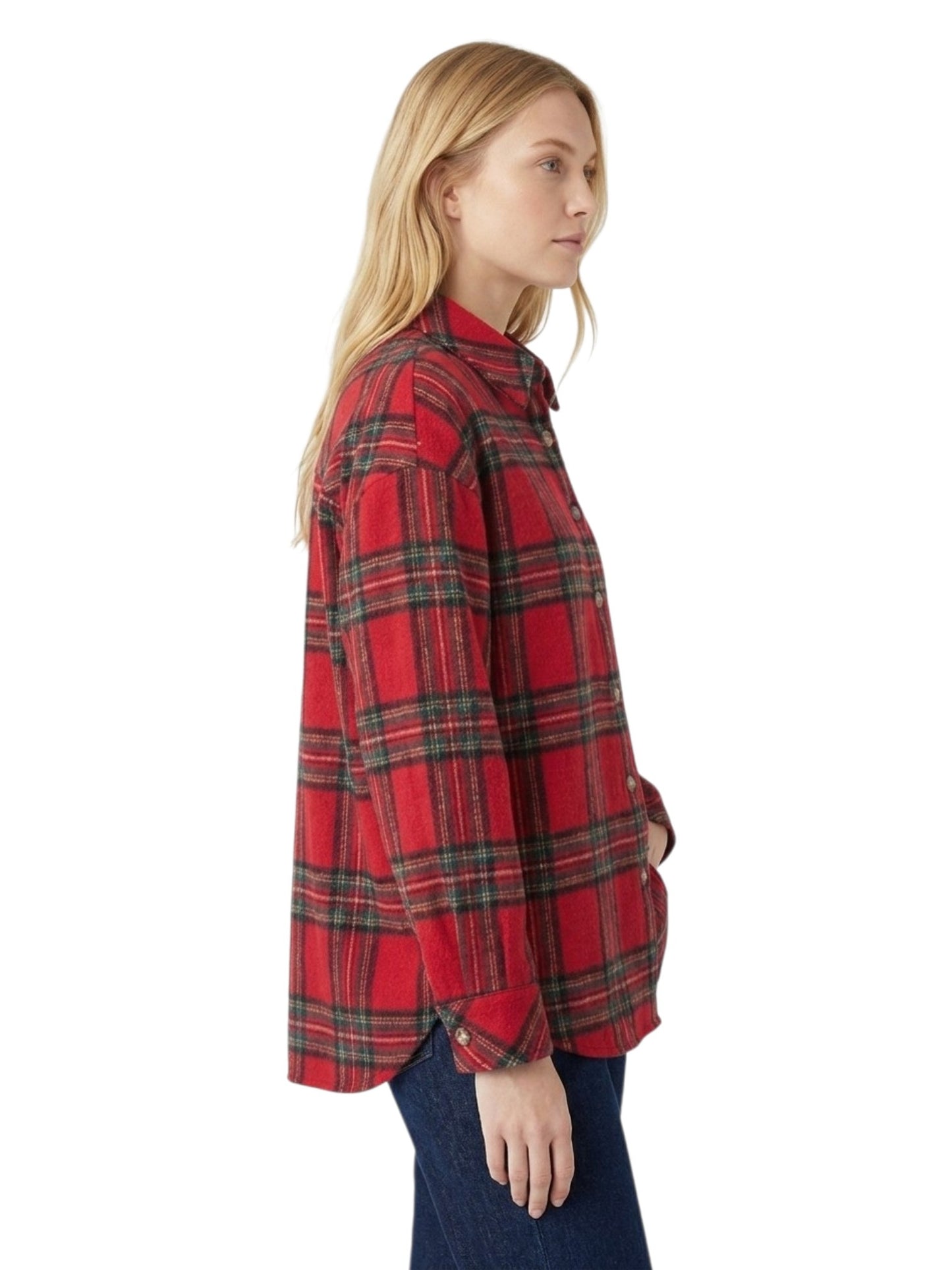 A woman shown in side profile wearing a red and black plaid button-up shirt with dark blue jeans, photographed against a plain white background.