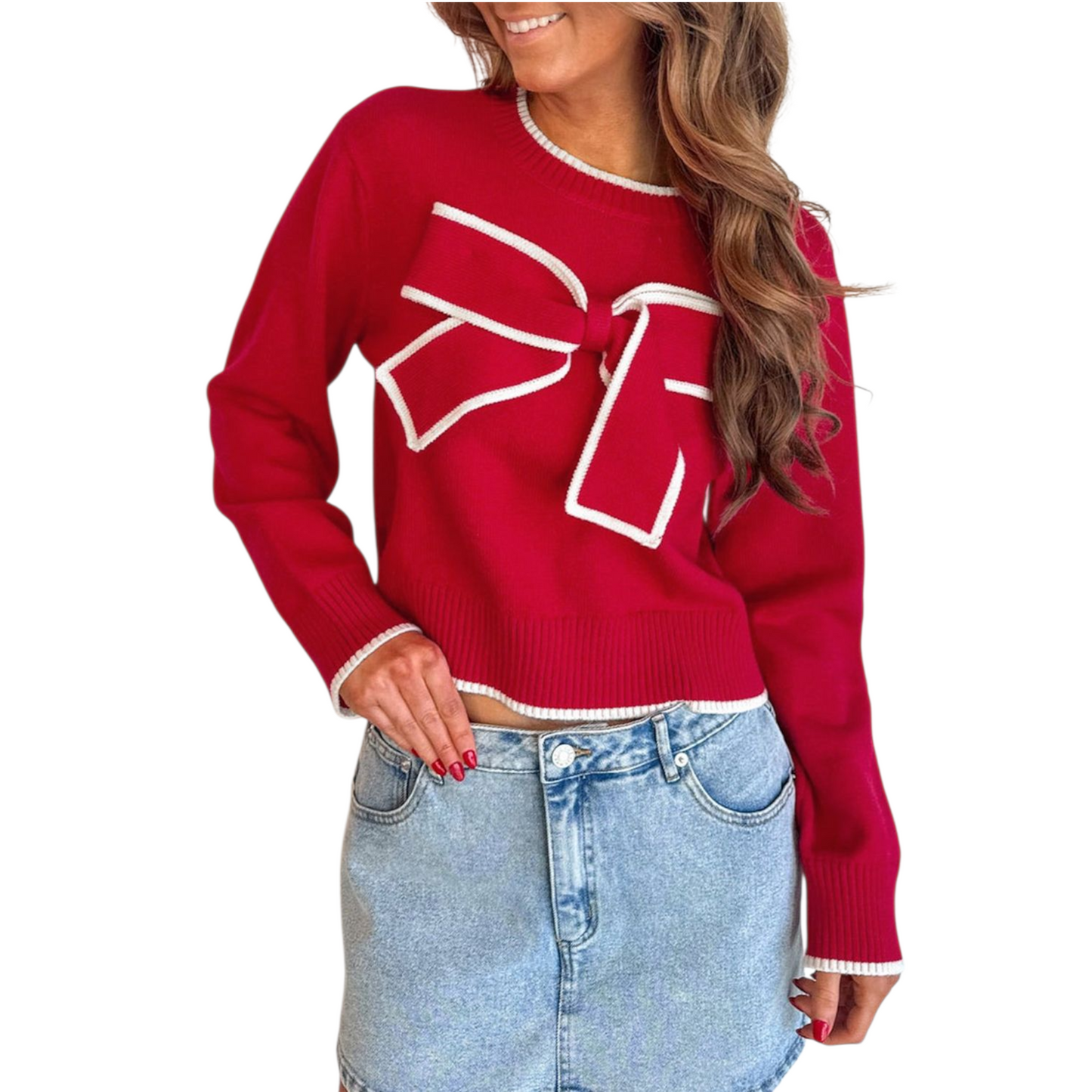 Red sweater with a large white bow design worn by a person on a white background