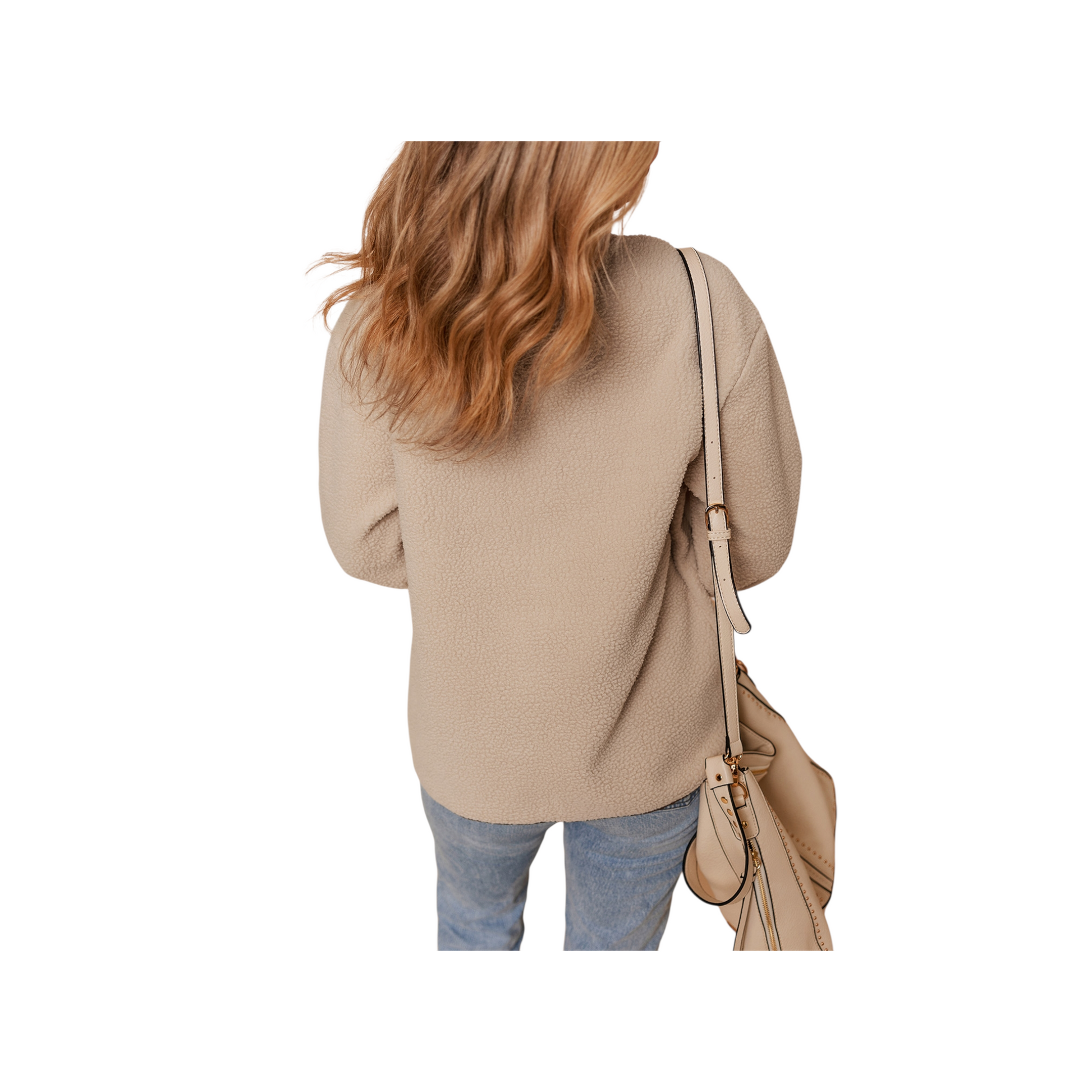 Person wearing a beige sweater and holding a matching handbag on a white background