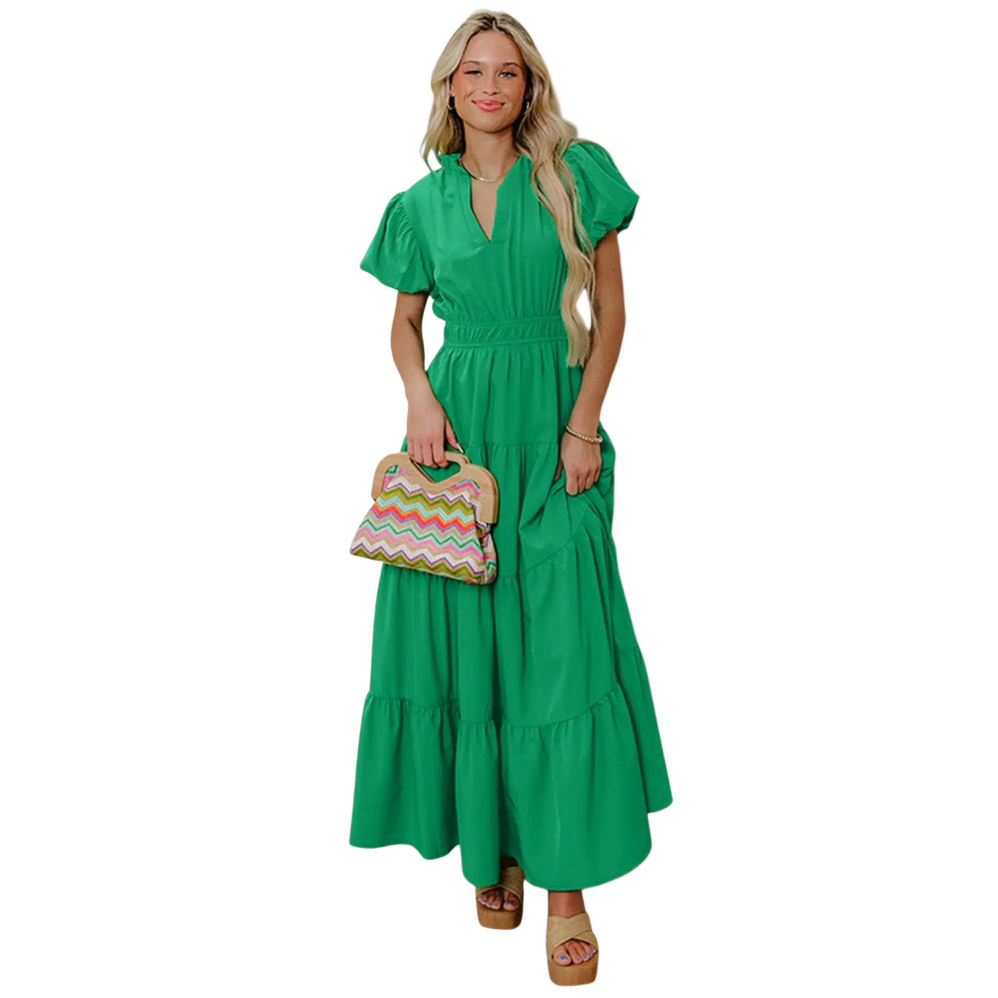 A woman wearing a vibrant green tiered maxi dress with short puff sleeves, a flattering V-neckline, and an elongated high-waist silhouette.