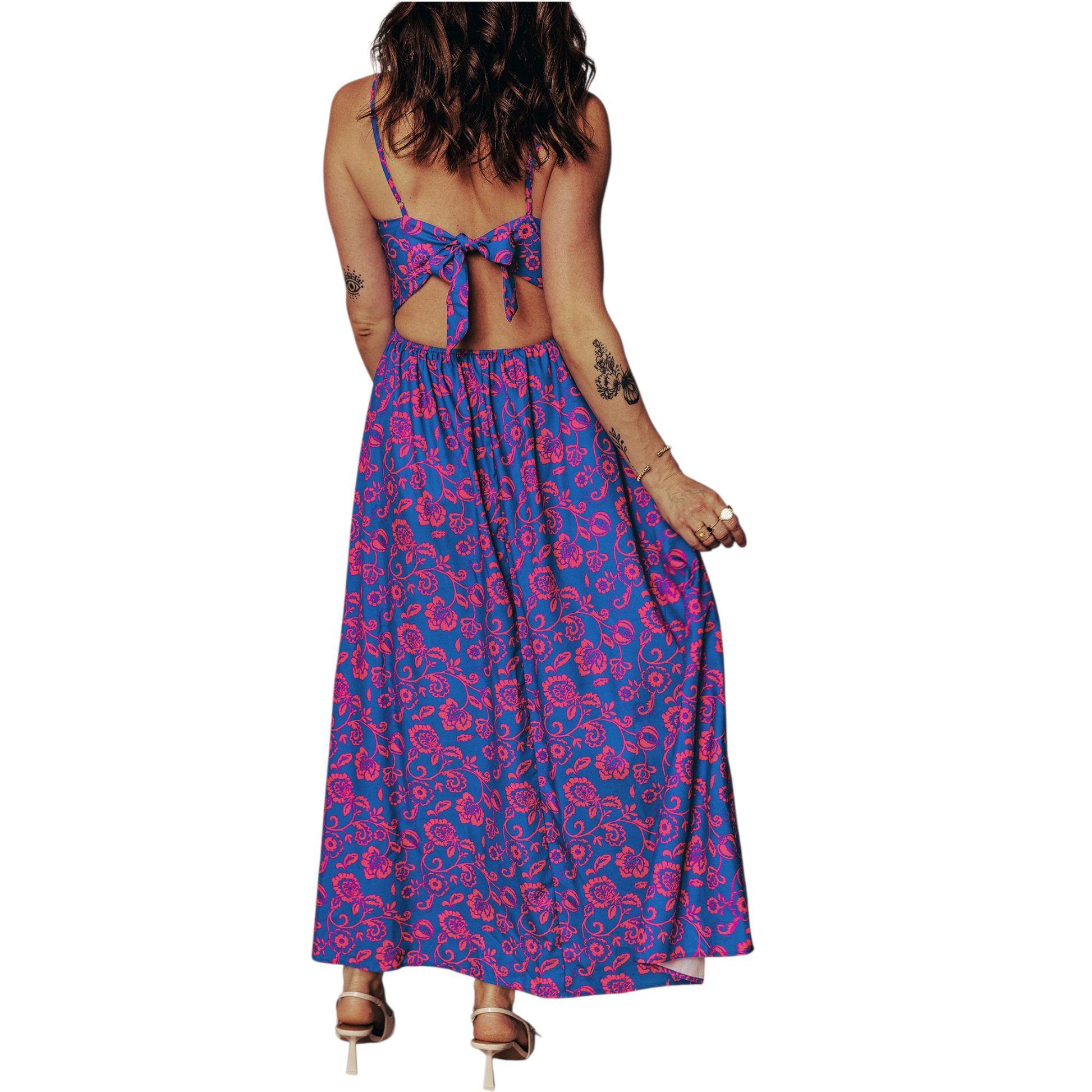 Rear view of a backless floral summer dress featuring an elegant tie-back bow detail and a flowy A-line maxi skirt.