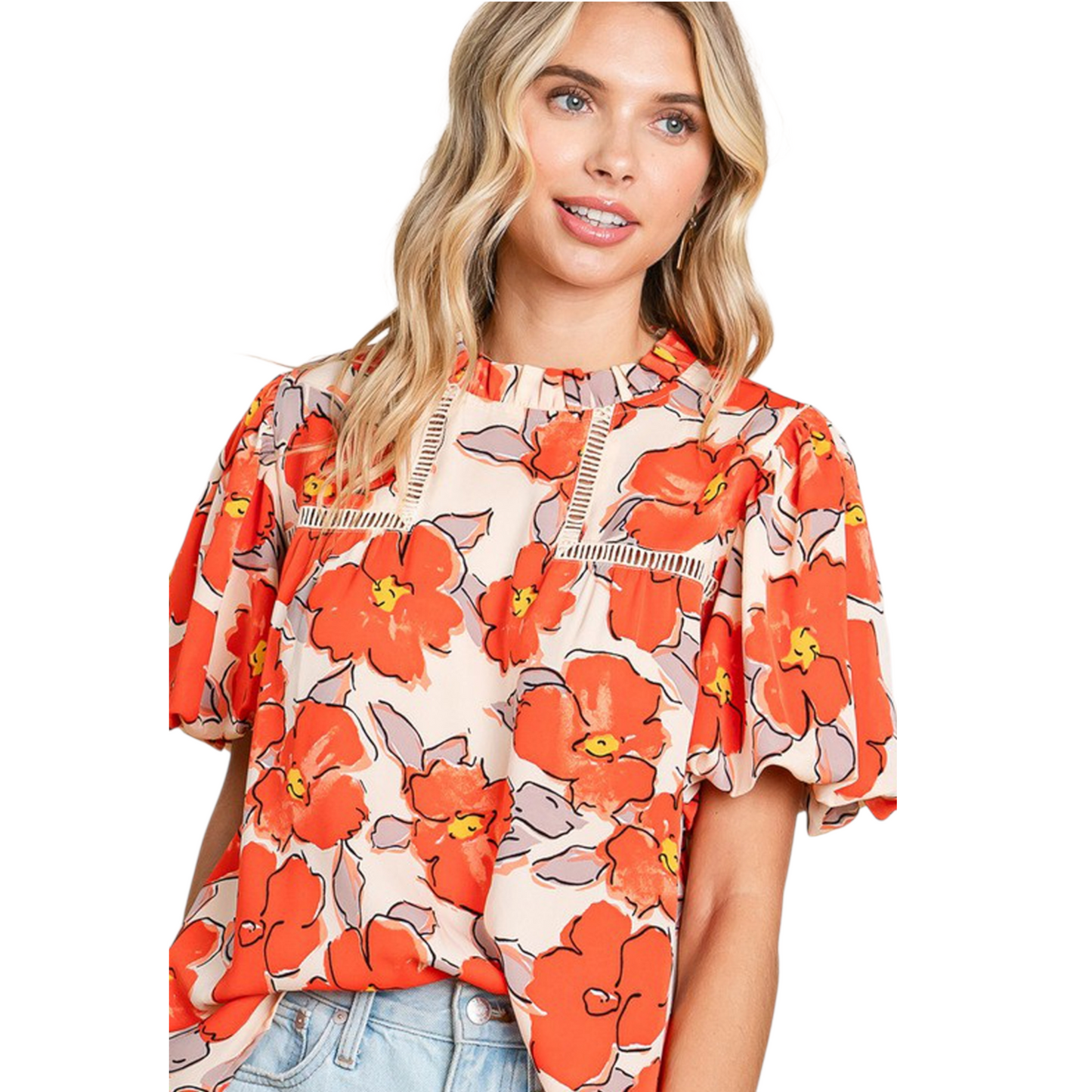 Close-up view of a vibrant floral print blouse with bubble sleeves and a ruffle high-neck collar.