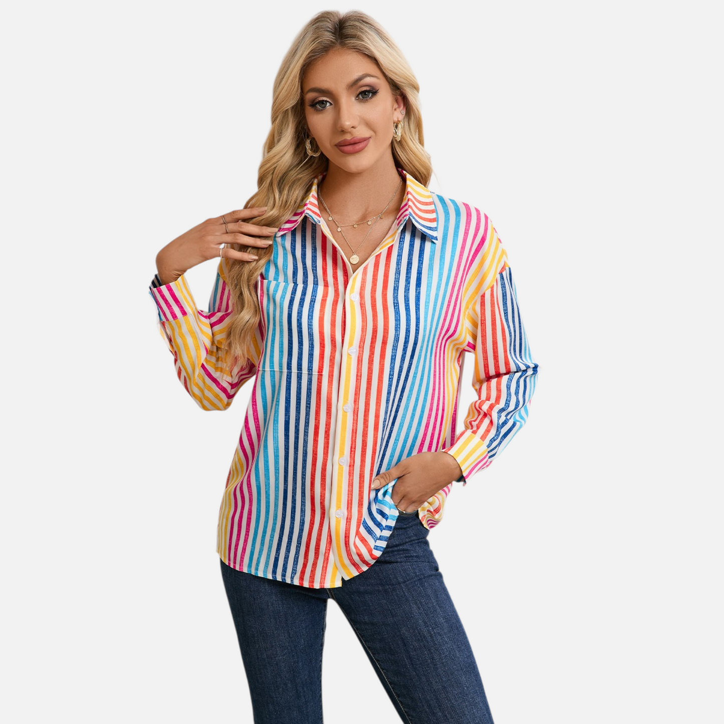 Front view of a woman wearing a vibrant vertical stripe shirt with a drop shoulder design and multicolour rainbow patterns.