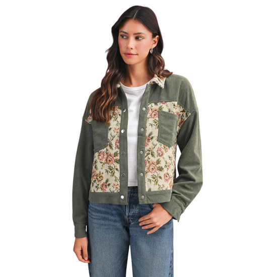 Sage green corduroy jacket on a model featuring floral tapestry patchwork panels and two front pockets.