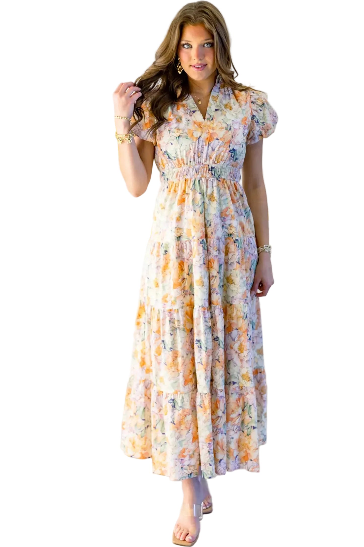 Front full-length shot of the model wearing the pastel floral V-neck dress, showcasing the elastic smocked waistband.
