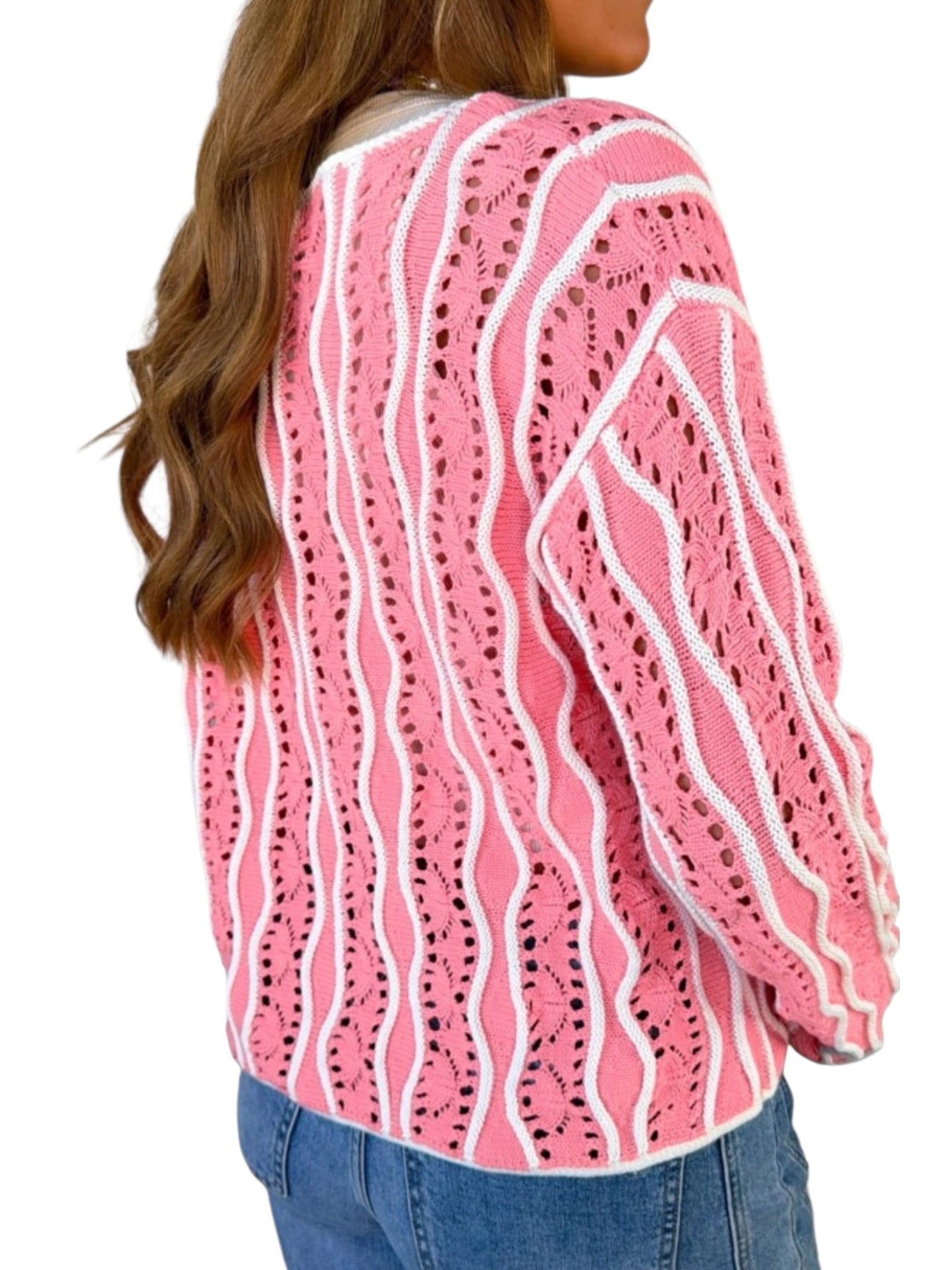 A woman wearing a pink and white wavy open-knit cardigan sweater, shown from the back against a plain white background.