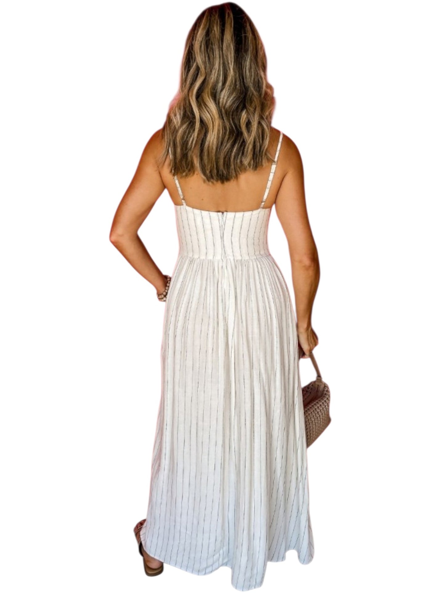 Woman wearing a white striped dress with thin straps on a white background back view