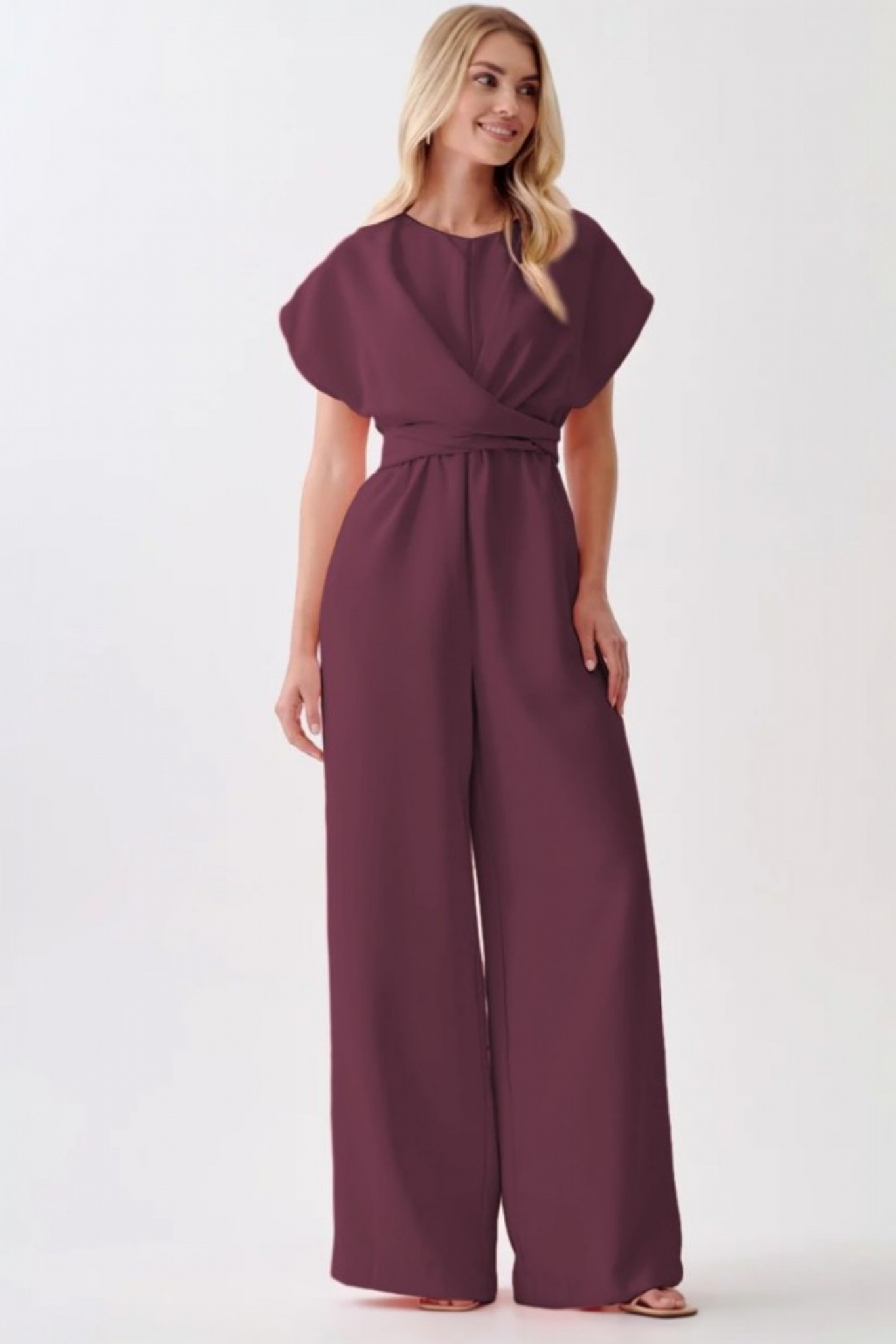Full-length view of the tailored wide-leg jumpsuit, highlighting the smooth polyester-elastane drape and professional cap-sleeve design.