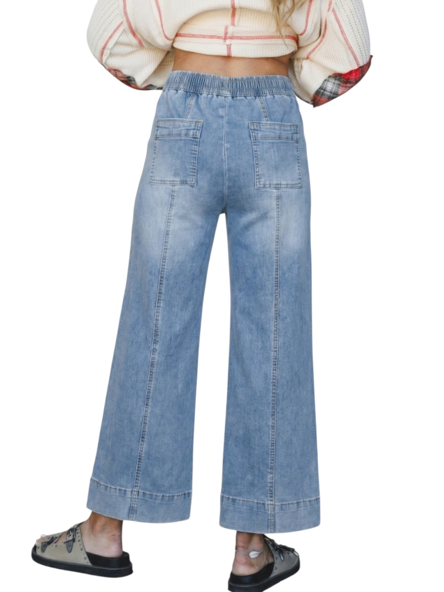Wide leg drawstring denim jeans on model back view against a white neutral background