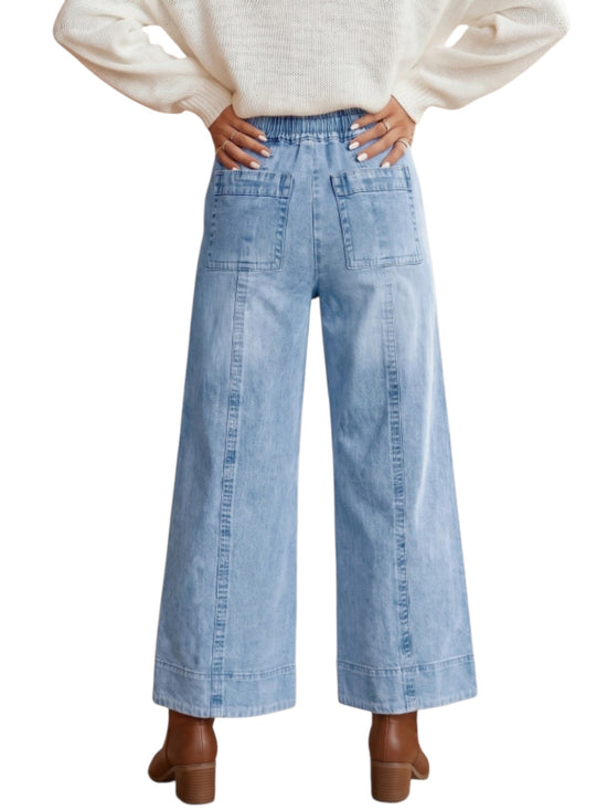 Wide leg drawstring denim jeans on model back view