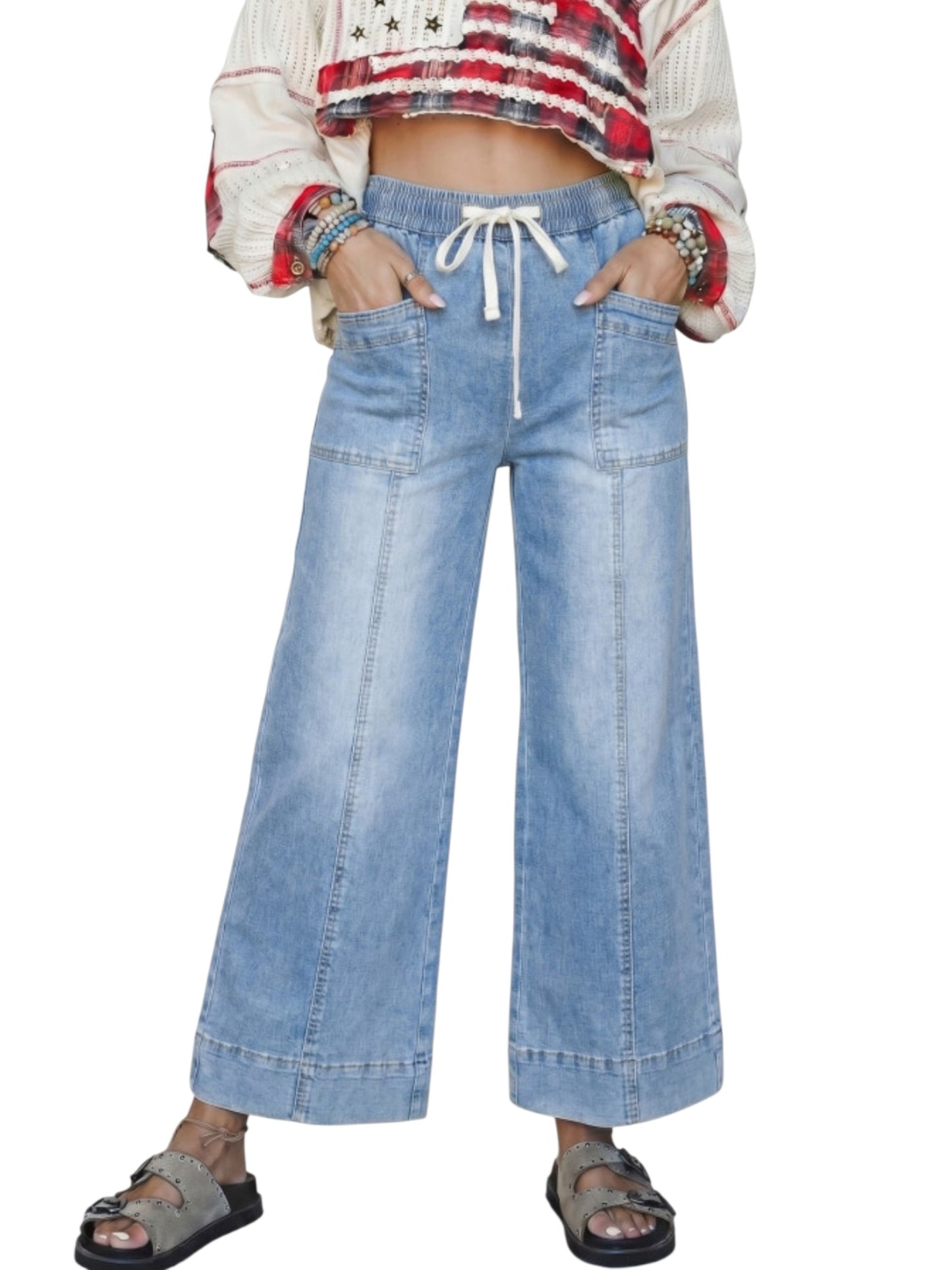 Wide leg drawstring denim jeans on model front view against a white neutral background