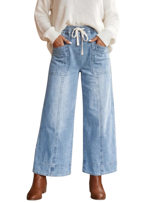Wide leg drawstring denim jeans on model front view