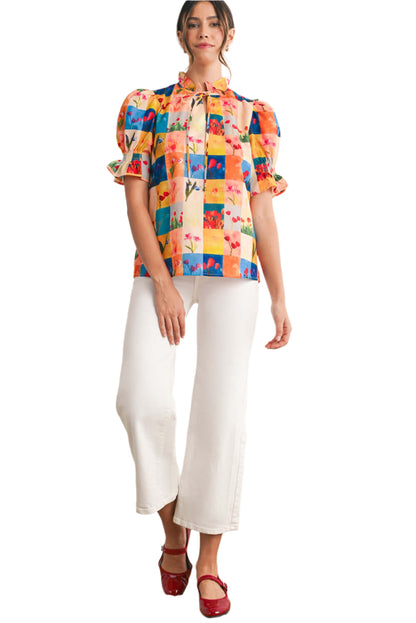 Women wearing a multicolour floral checked blouse with short puff sleeves, ideal for summer casual occasions.