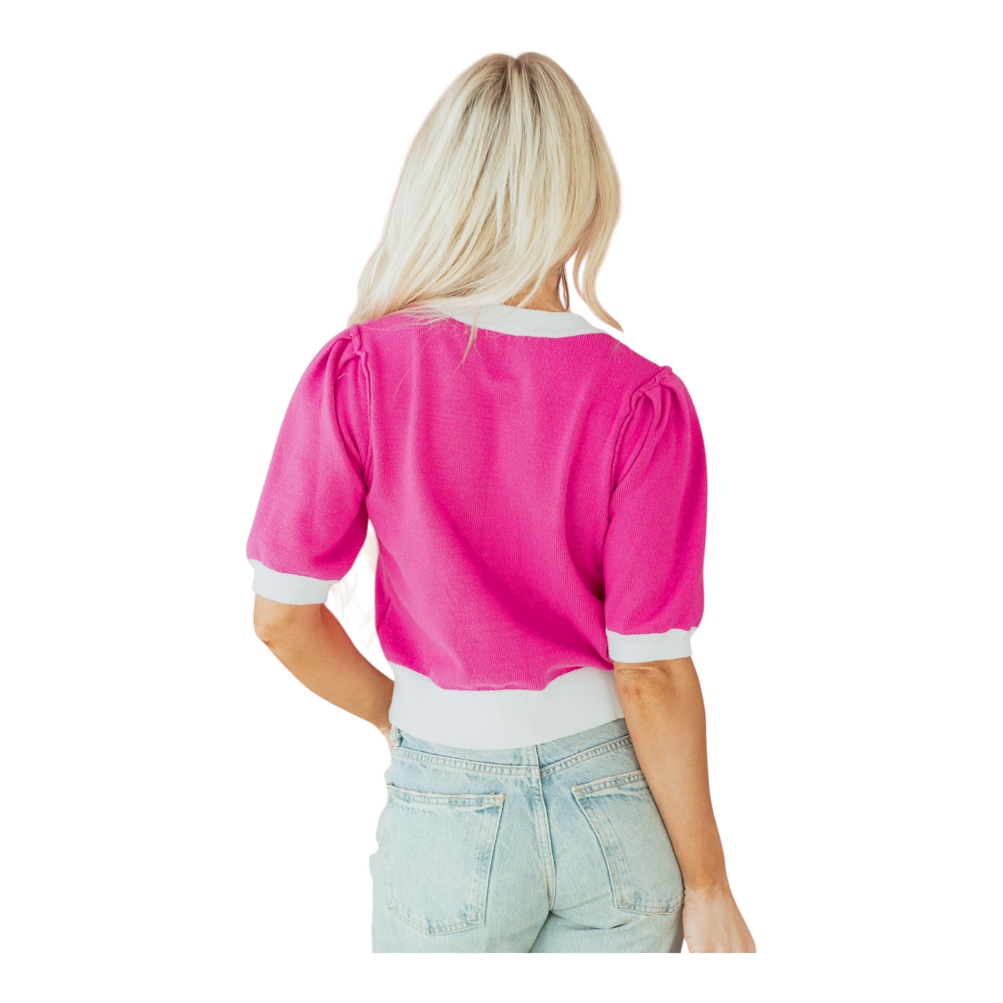 Person wearing a bright pink top with white trim on a white background